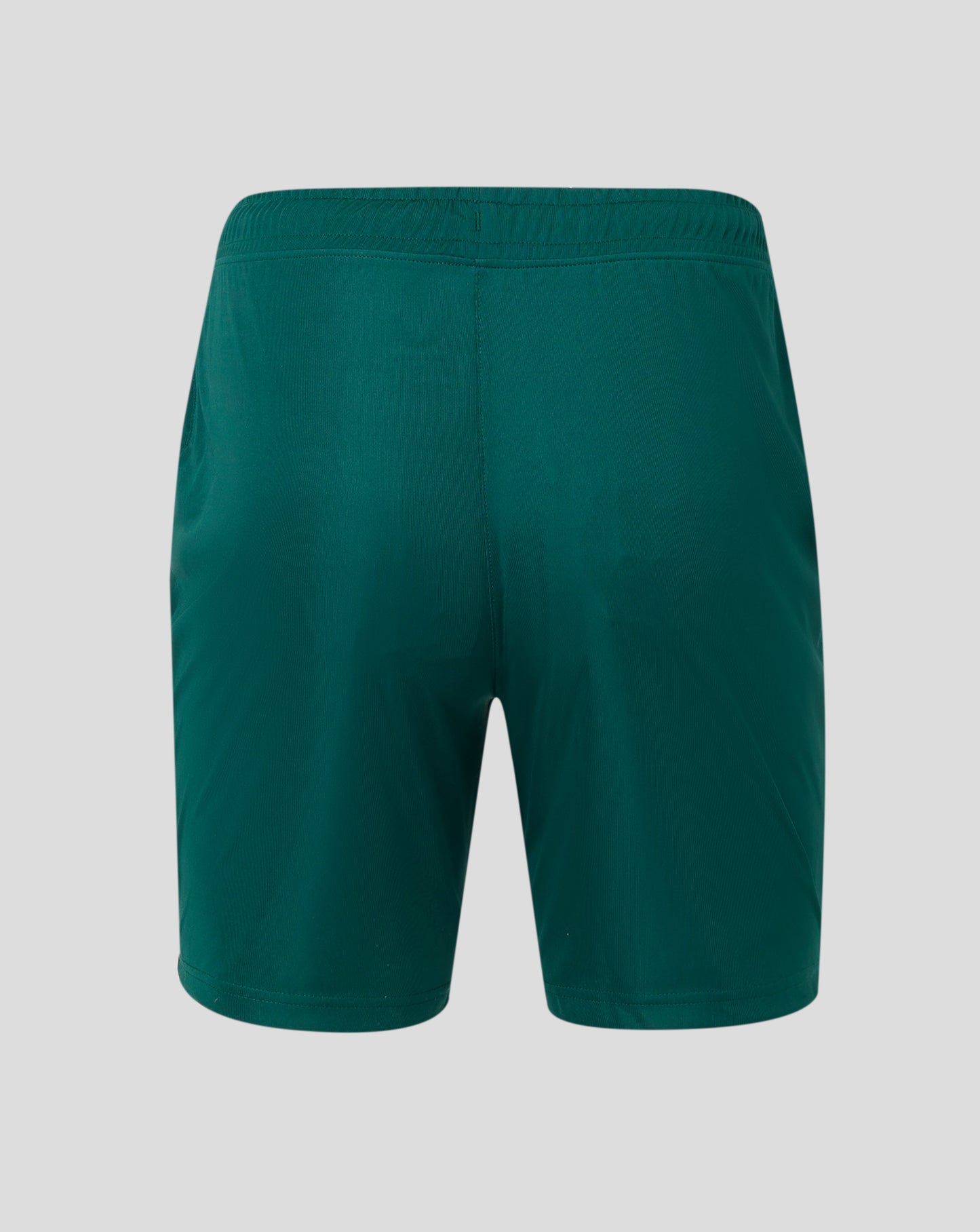 Back view of green Botanical Garden shorts showing elastic waistband and Castore logo near the hem