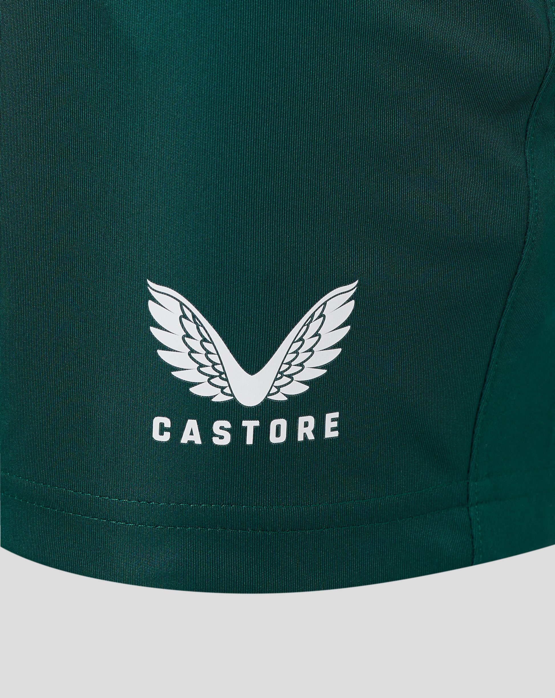 Close up of green botanical garden shorts fabric with an elastic waistband and heat sealed Castore logo