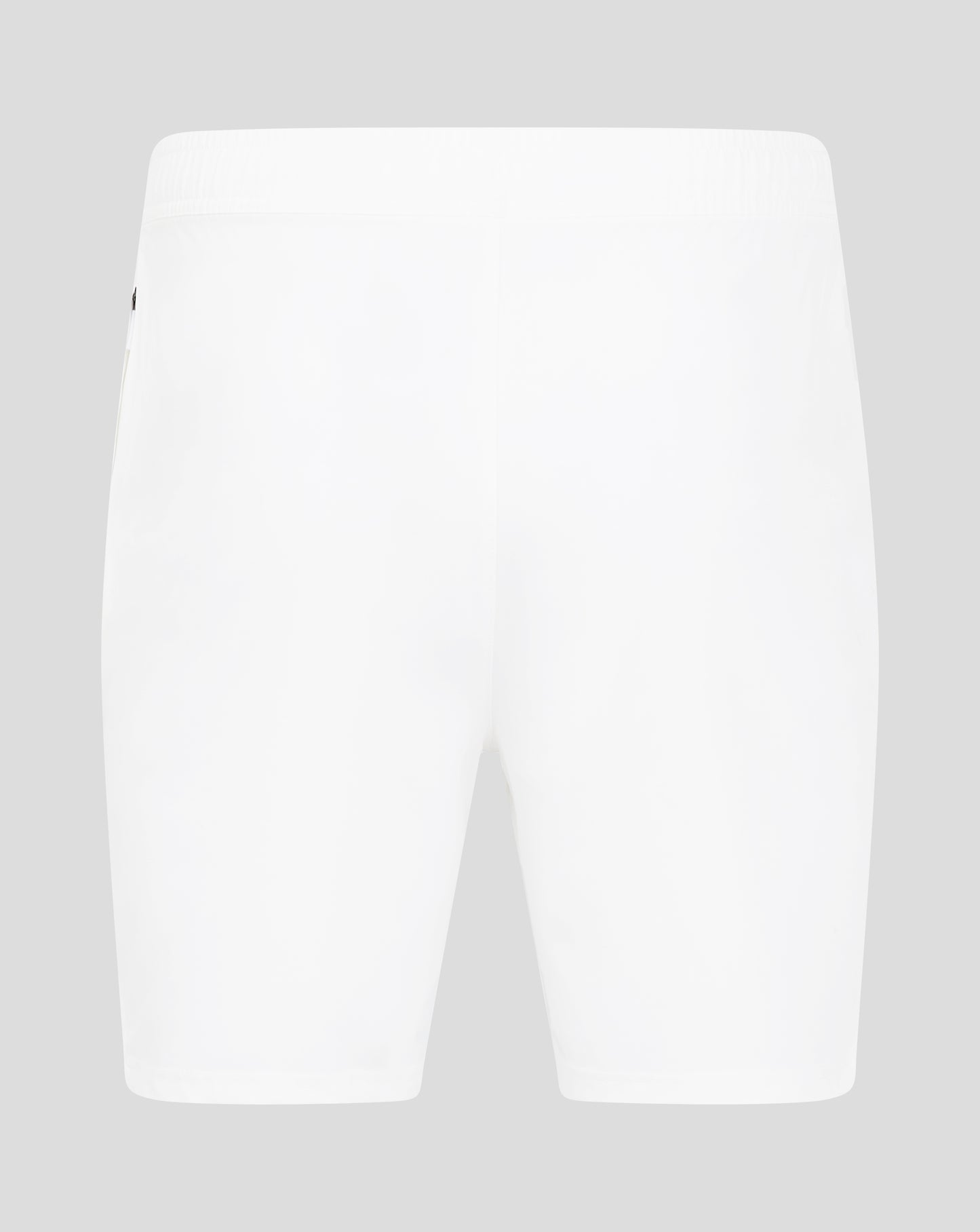 Close-up of the waist area of white woven training shorts