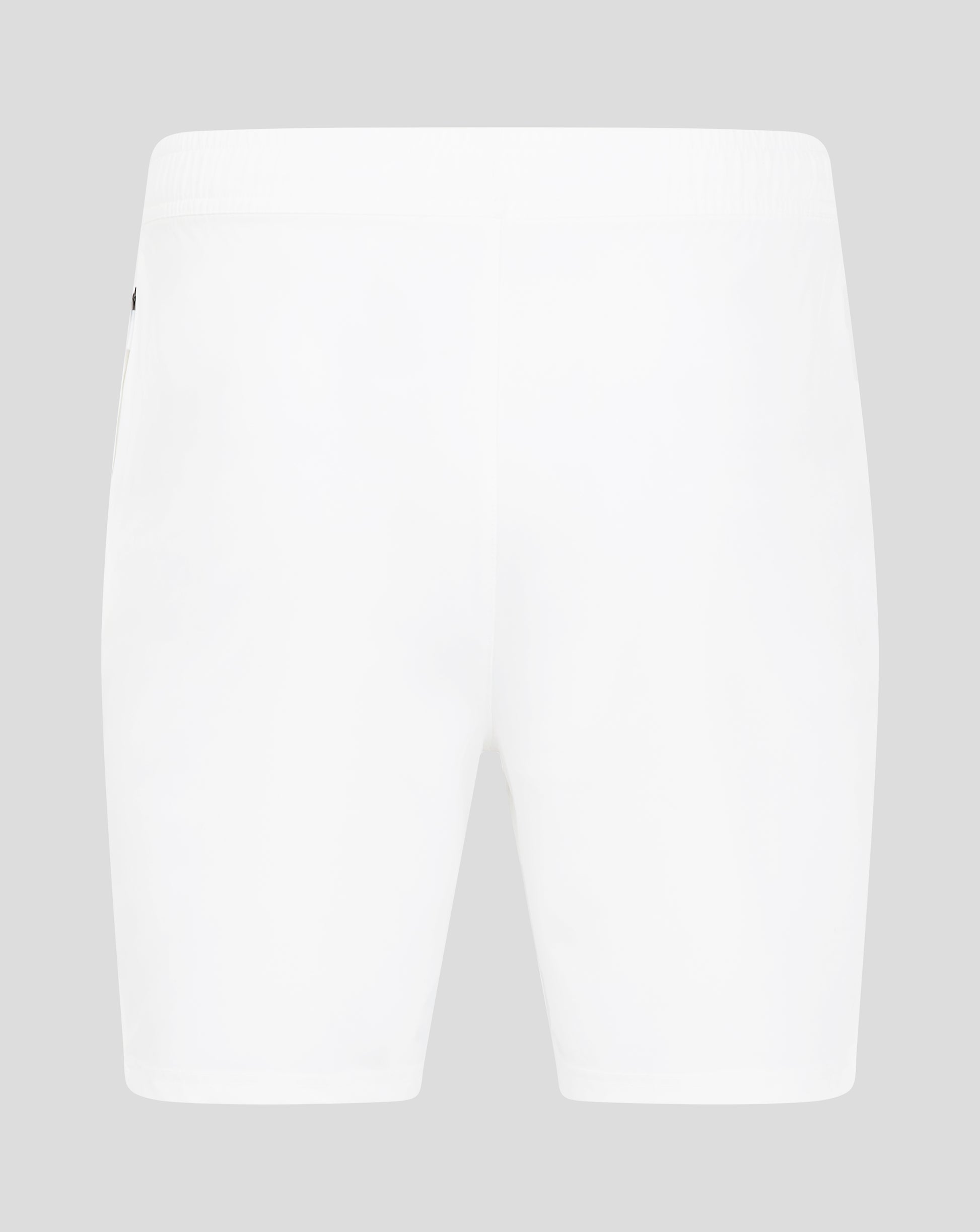 Close-up of the waist area of white woven training shorts