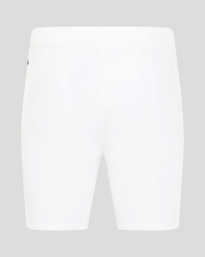 Close-up of the waist area of white woven training shorts