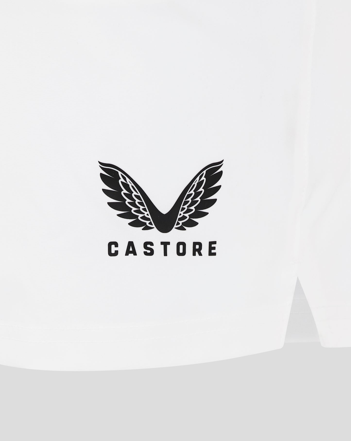 White Castore packaging featuring the brand's black wing logo