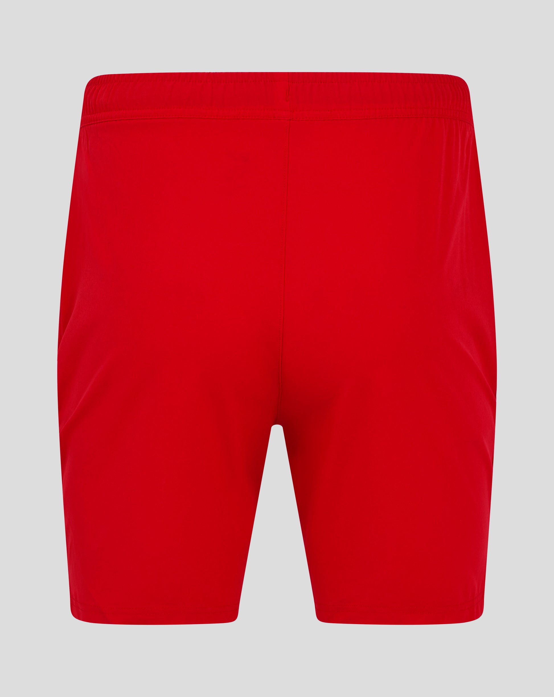 Back view of bright red mens woven training shorts with an elastic waistband and central seam.