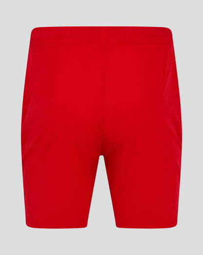 Back view of bright red mens woven training shorts with an elastic waistband and central seam.