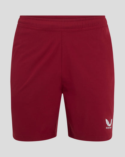 Rear view of red woven training shorts with elastic waistband