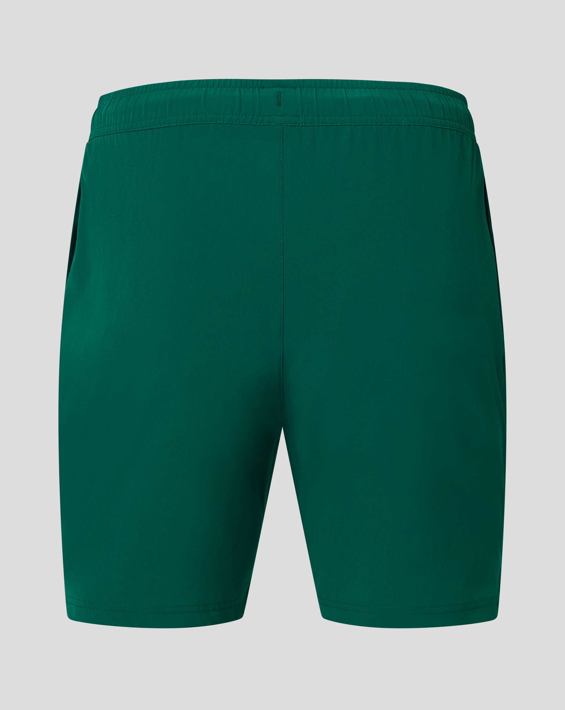 Back view of Botanical Garden green woven training shorts with elastic waistband and central seam.