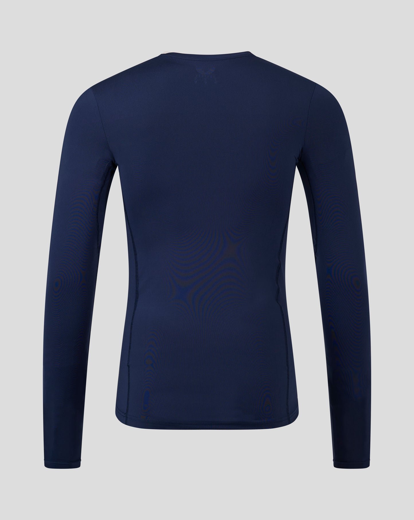 Back view of navy peacoat Baselayer long sleeve top with upper back logo and clean seam lines