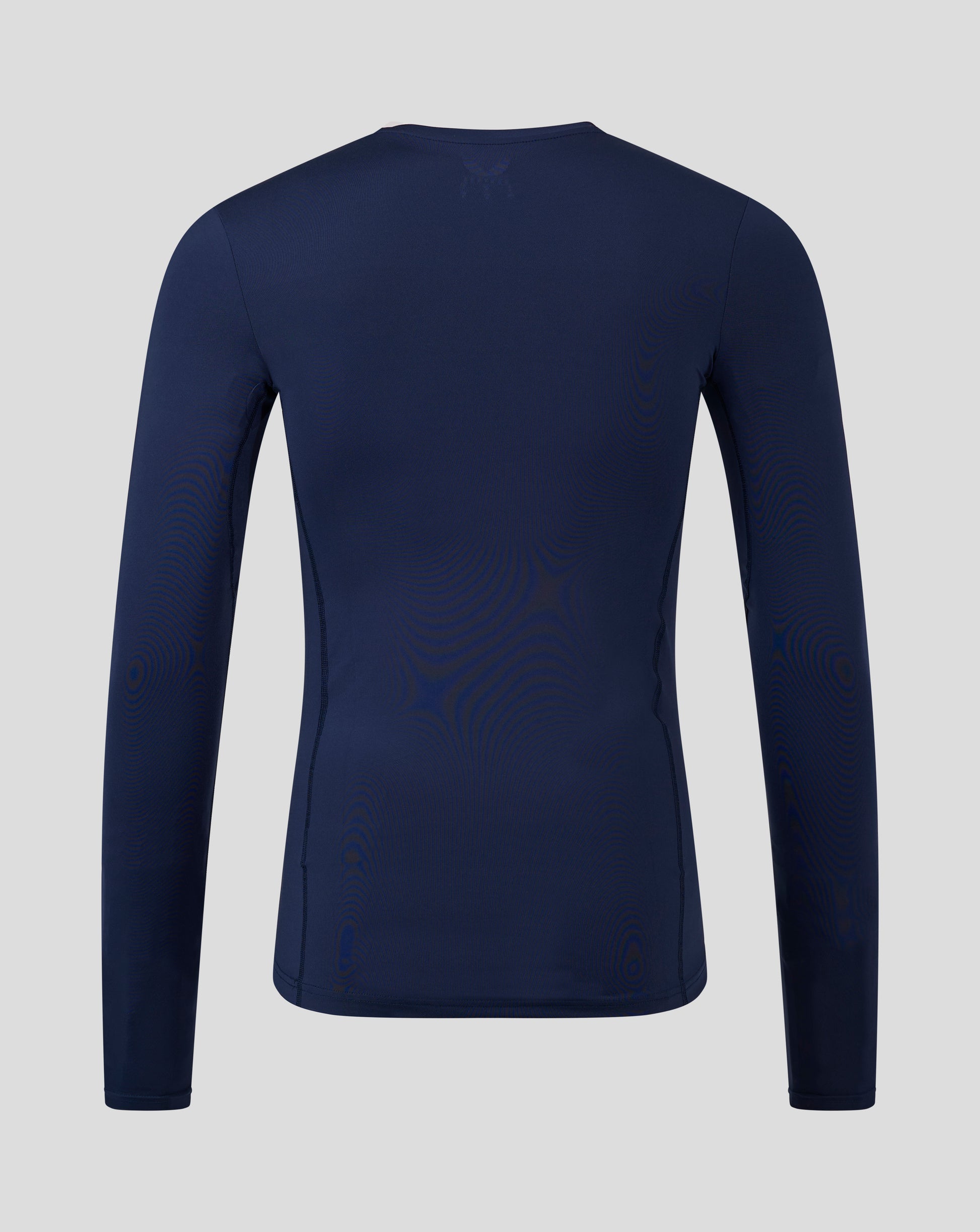 Back view of navy peacoat Baselayer long sleeve top with upper back logo and clean seam lines
