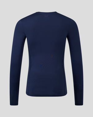 Back view of navy peacoat Baselayer long sleeve top with upper back logo and clean seam lines