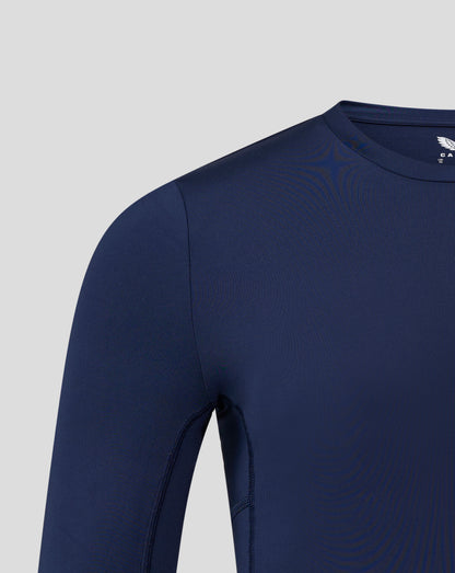 Navy long sleeve baselayer top angled view showing crew neck collar shoulder seam and subtle Castore branding