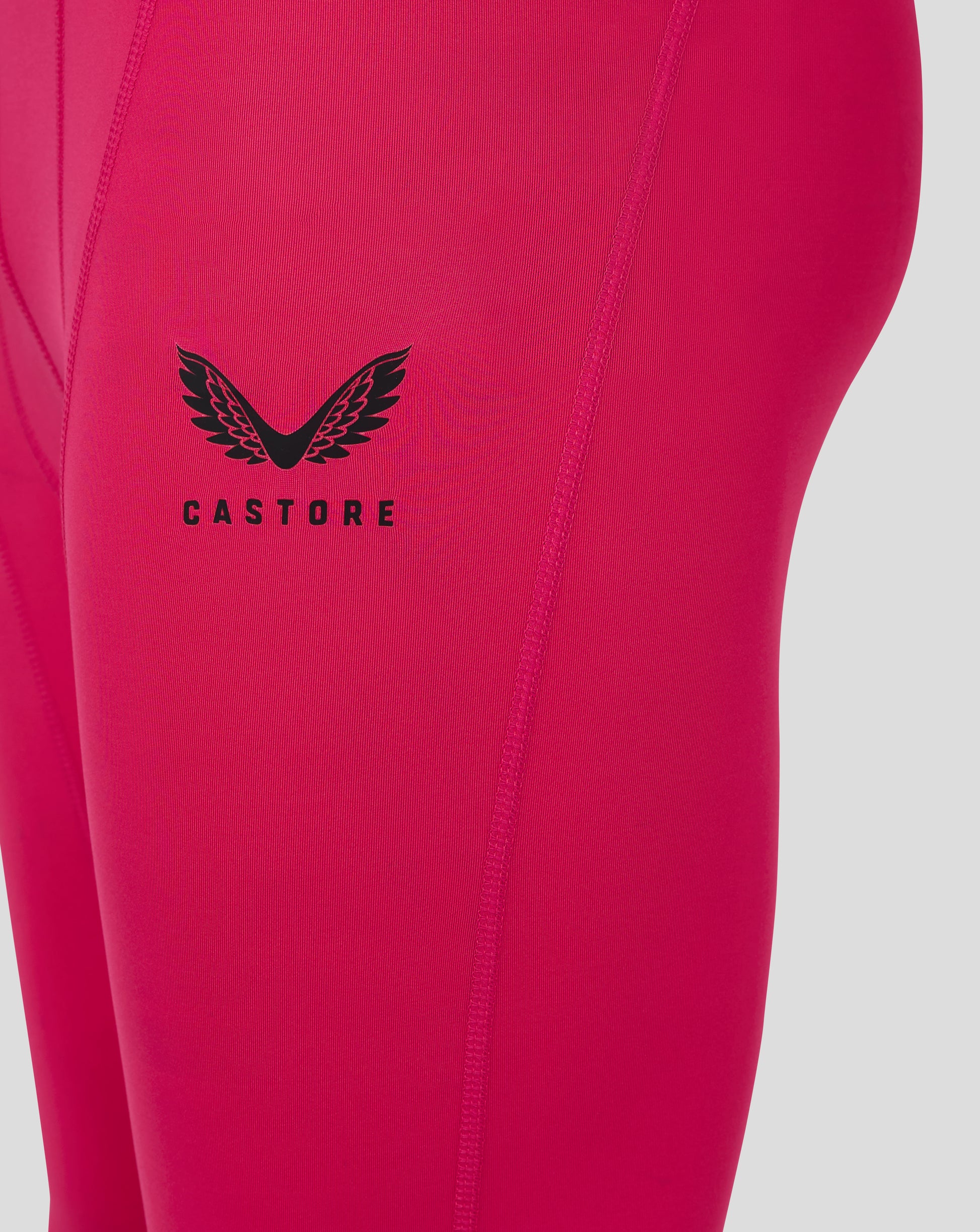 Beetroot purple mens baselayer legging close up of Castore wing logo on thigh