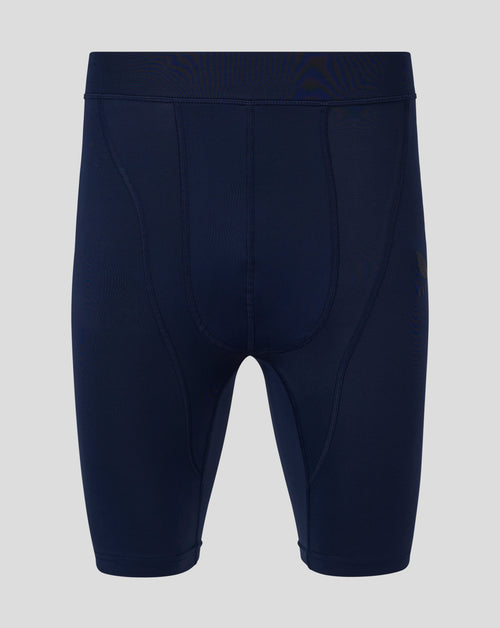Back view of navy Baselayer leggings with self fabric waistband and panel seams