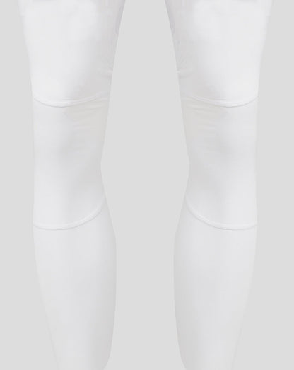 White leggings showing knee panel seams and curved stitching details