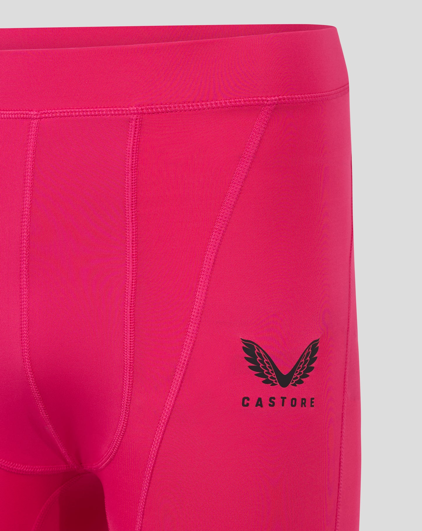 Beetroot purple mens baselayer shorts close up of side with Castore logo and wing emblem