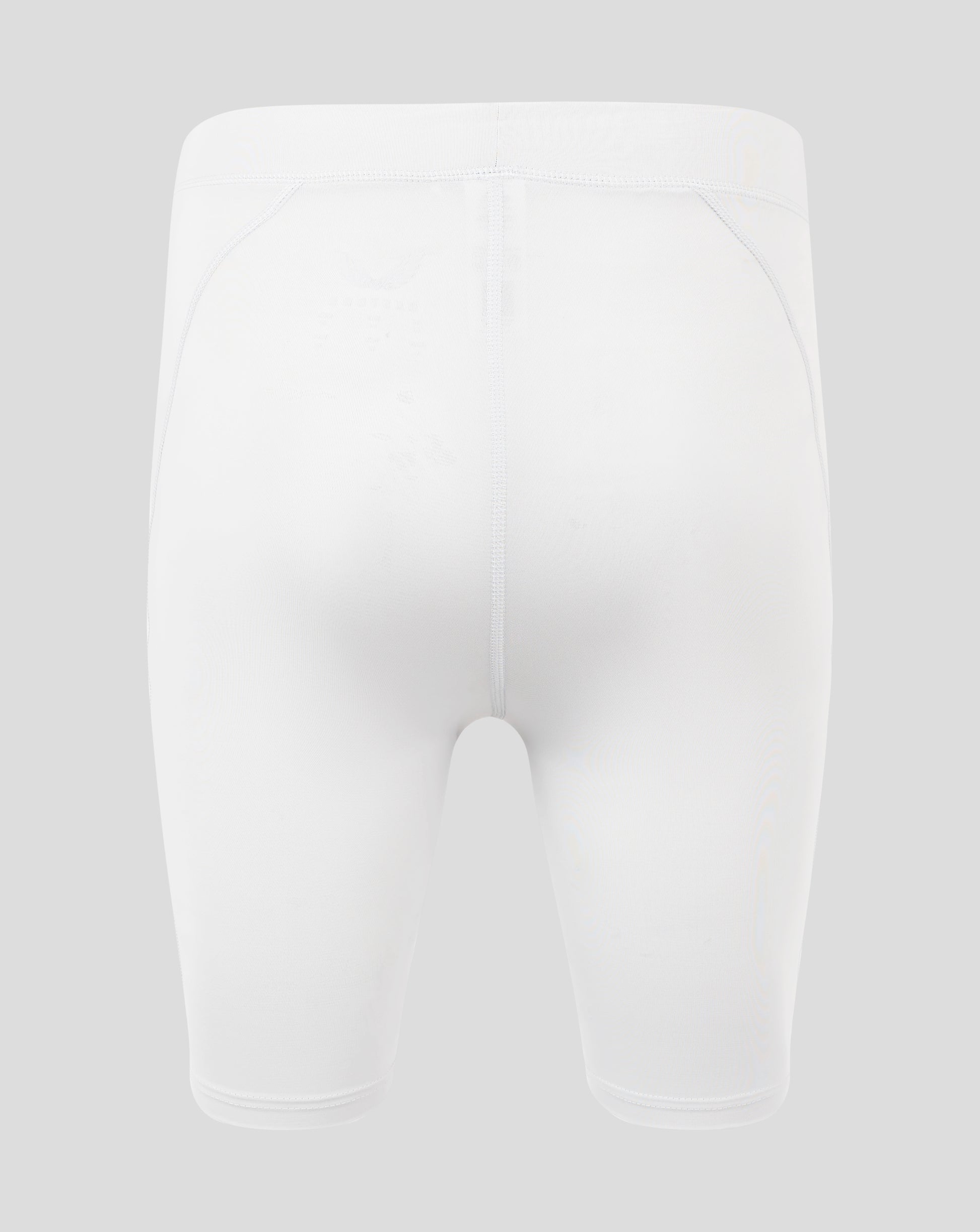 Back view of white mens baselayer shorts with high rise waistband and curved panel seams and Castore logo on the right hip