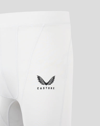 Back close up of white baselayer shorts with seam panels and a Castore logo near the lower center