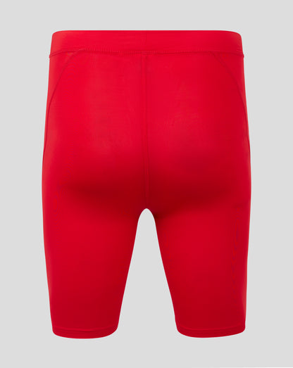 Rear view of red baselayer short showing folded waistband and flatlock seams