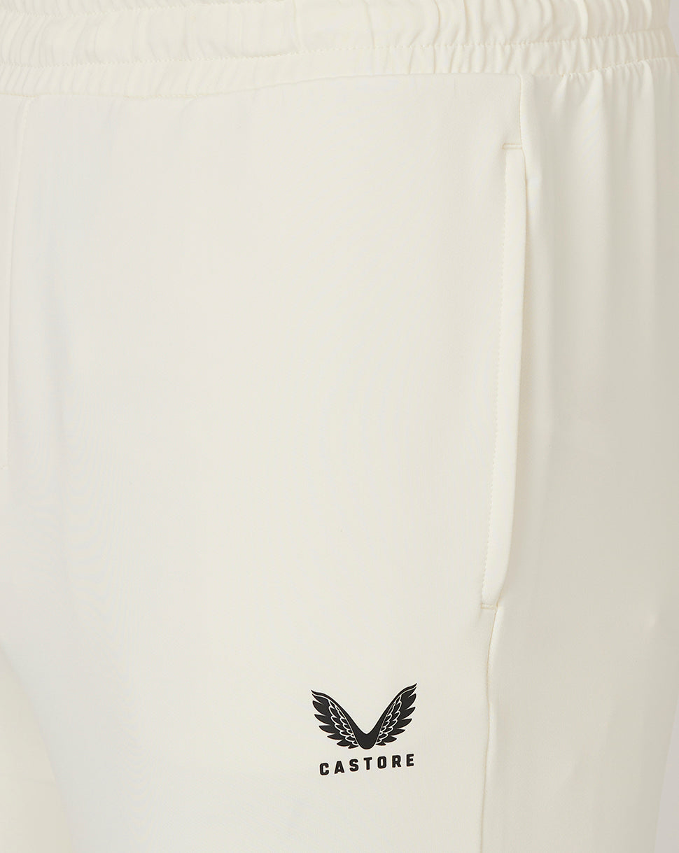 Cream cricket trousers close-up of hip pocket area with Castore logo on the leg