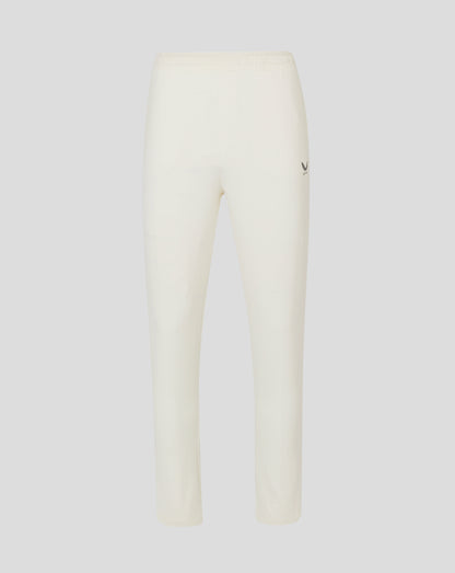 Cannoli Cream junior cricket trousers with drawcord waist mock fly front open side pocket mesh panels and heat sealed Castore logo