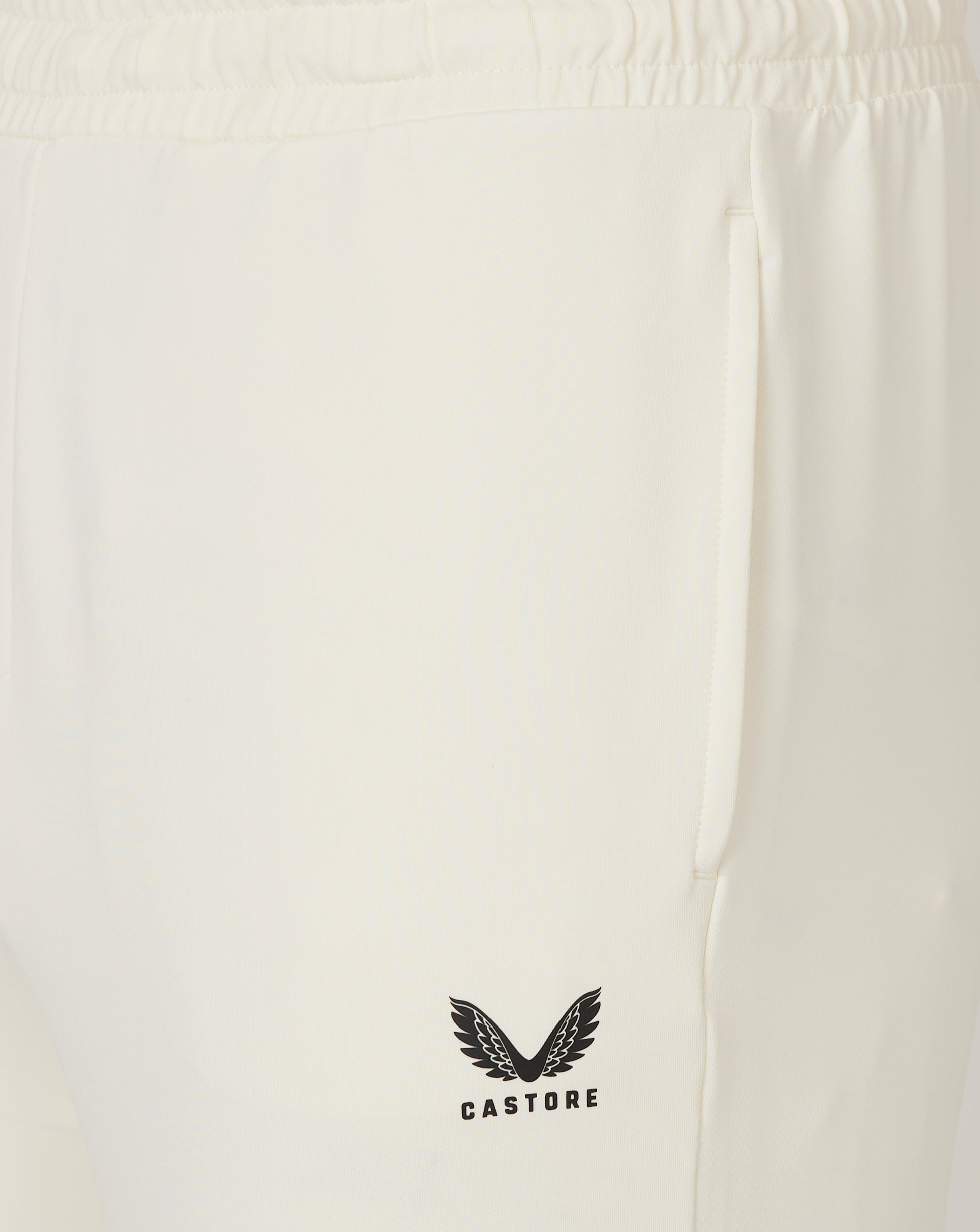 Junior Cricket Trouser Cannoli Cream close up with side pocket and Castore logo