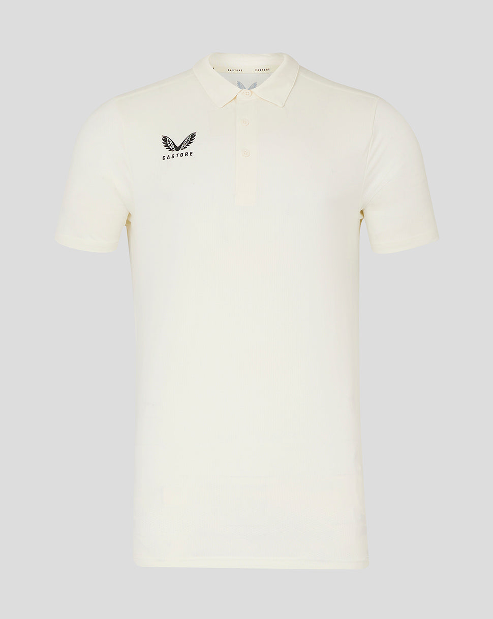Cream short sleeve cricket tech polo with three button placket and Castore logo on chest