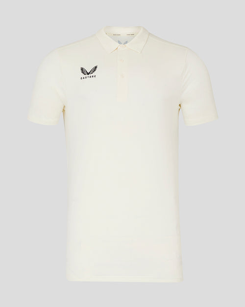 Cream short sleeve cricket tech polo with three button placket and Castore logo on chest
