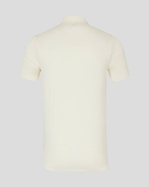 Back view of cream cricket short sleeve tech polo showing clean silhouette