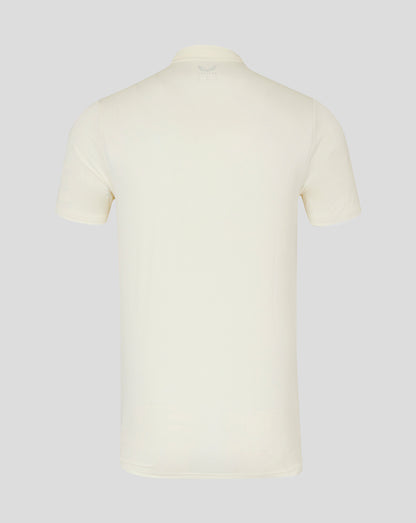 Back view of cream cricket short sleeve tech polo showing clean silhouette