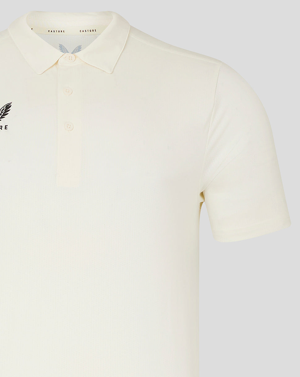 Cream short sleeve polo with Castore wing logo on left chest and three button placket.
