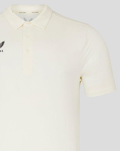 Cream short sleeve polo with Castore wing logo on left chest and three button placket.
