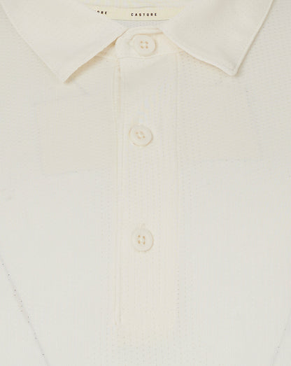 Close up of collar and three button placket on Cannoli Cream Castore cricket shirt