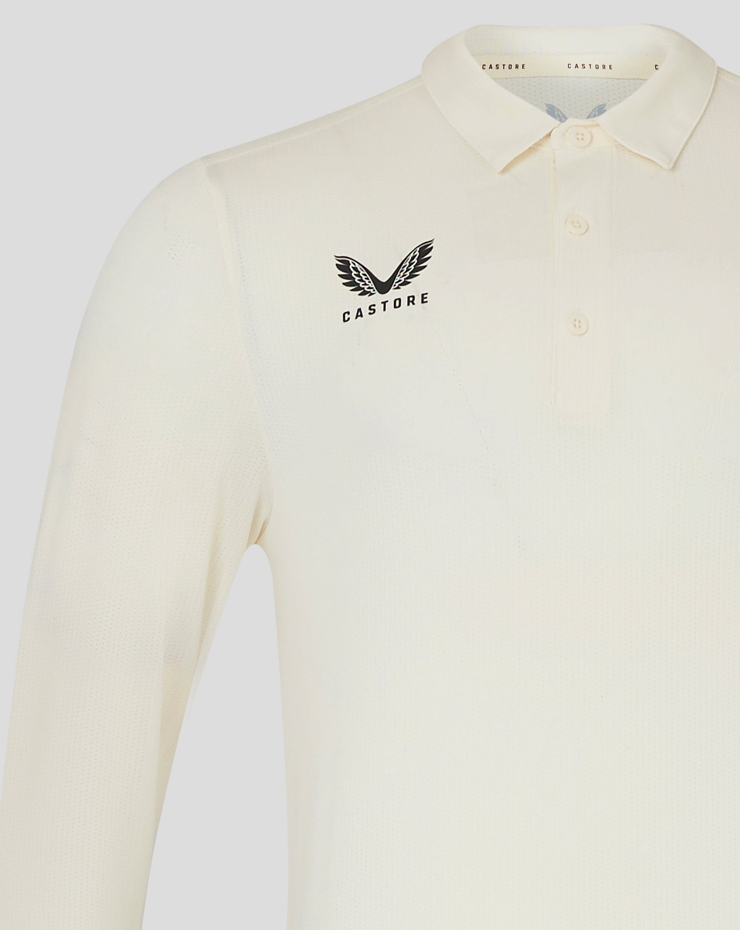 Cannoli Cream cricket shirt chest displays Castore wing logo