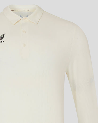Front view of Cannoli Cream Castore cricket shirt with collar and small chest logo