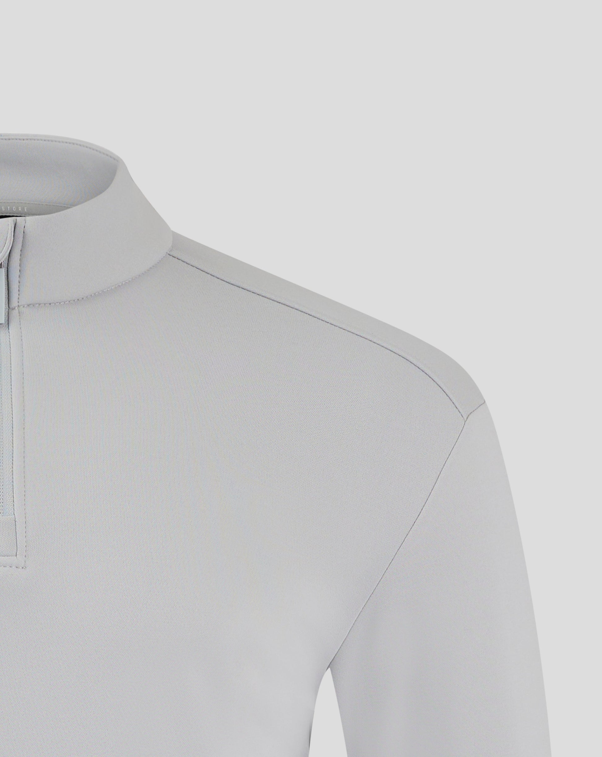 Close up of light gray fleece jacket showing funnel neck and zip detail with chest logo