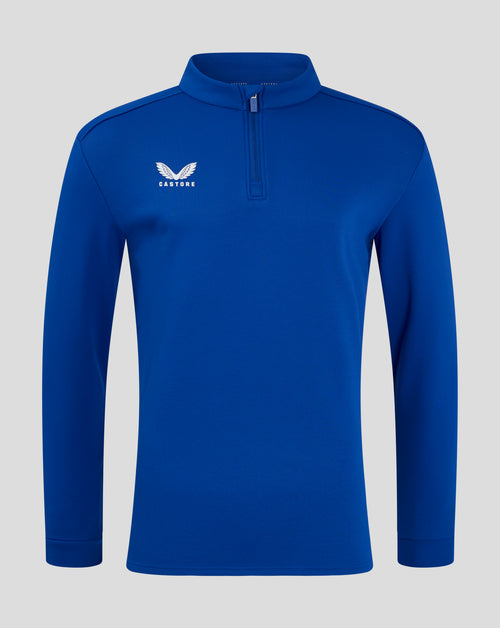 Front view of royal blue fleece with funnel neck and quarter zip with chin guard and Castore logo.