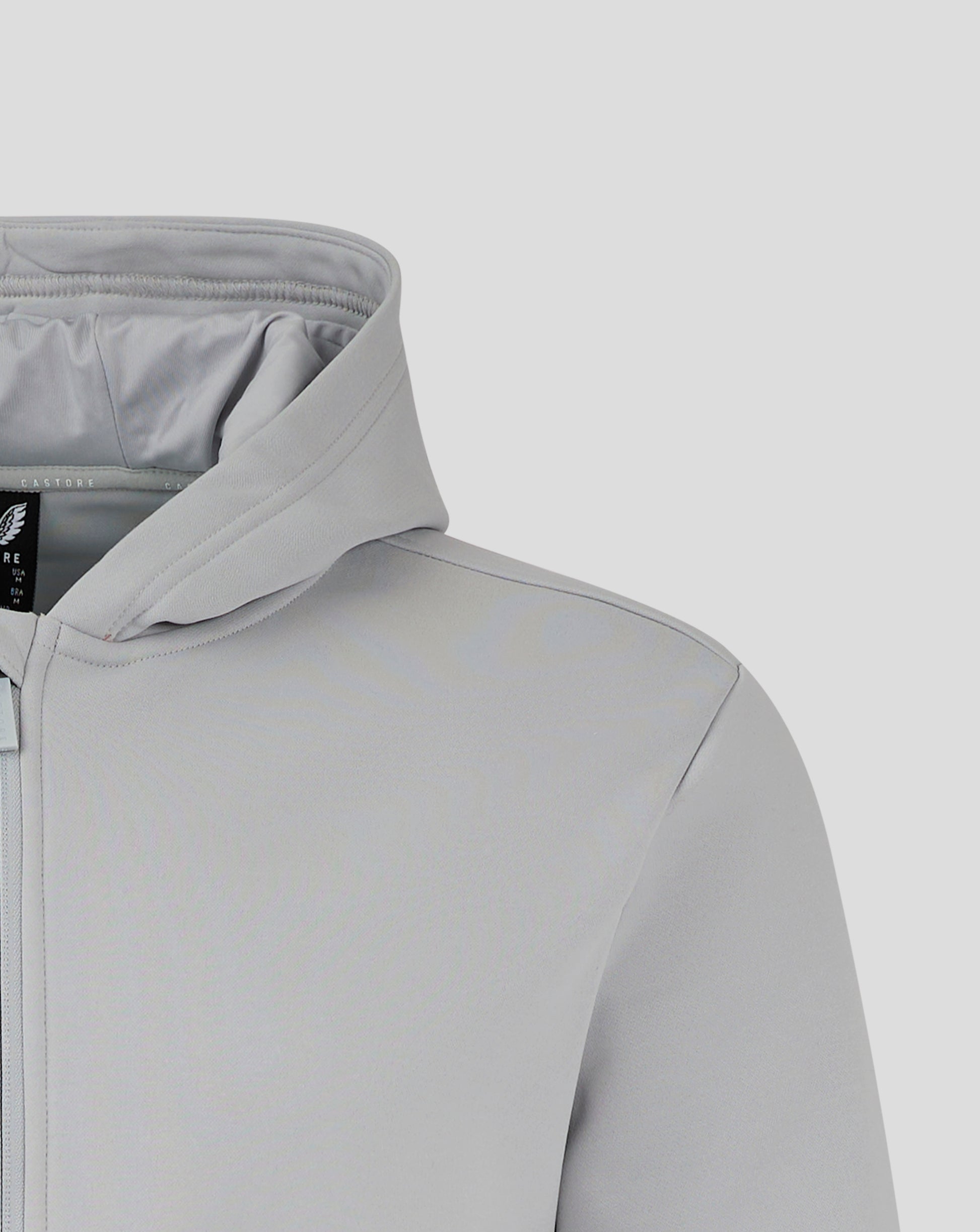 Front view of light gray Castore hoodie with winged logo on the chest and full zipper.