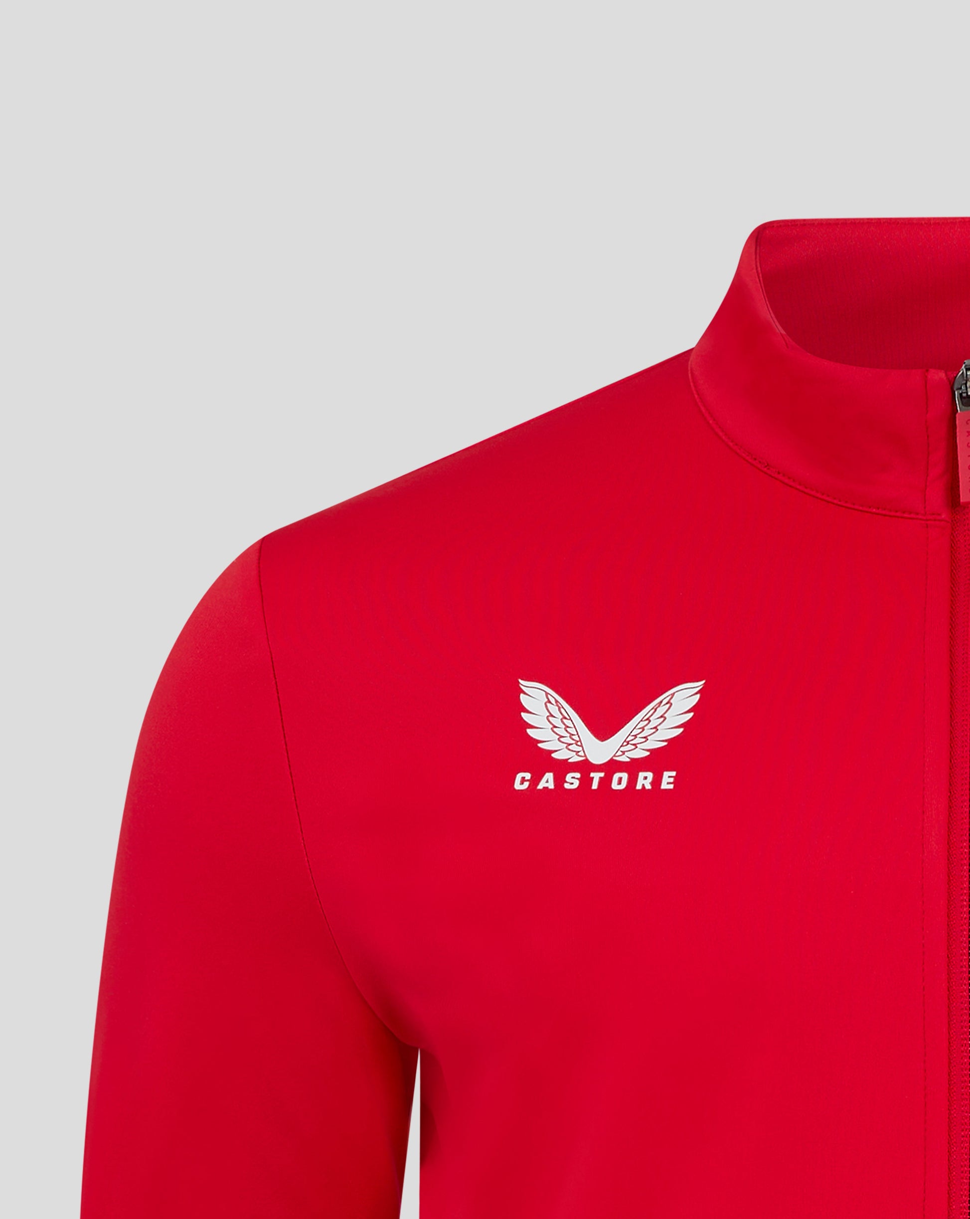 Red jacket chest area features a white Castore logo with wings