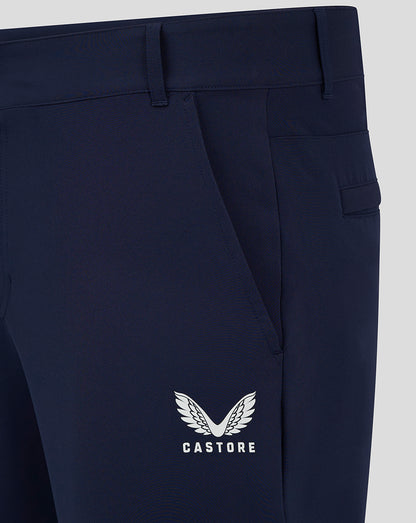 Close up of navy chino pant with Castore winged logo on lower thigh