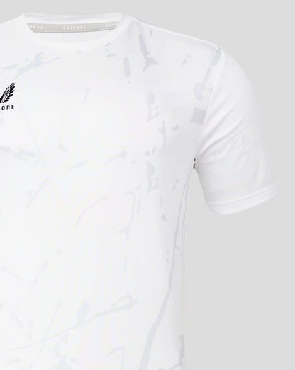 Front left chest Castore logo on a white Marble Performance Tee with a pale camouflage pattern