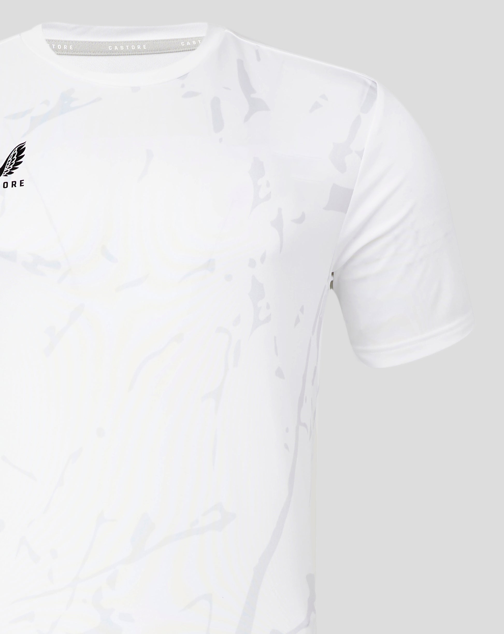 Brilliant white marble printed training tee with subtle gray pattern and wing logo on the left chest