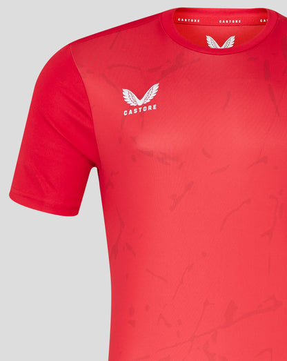 Close up of red Marble Performance Tee showing white Castore wing logo on the chest