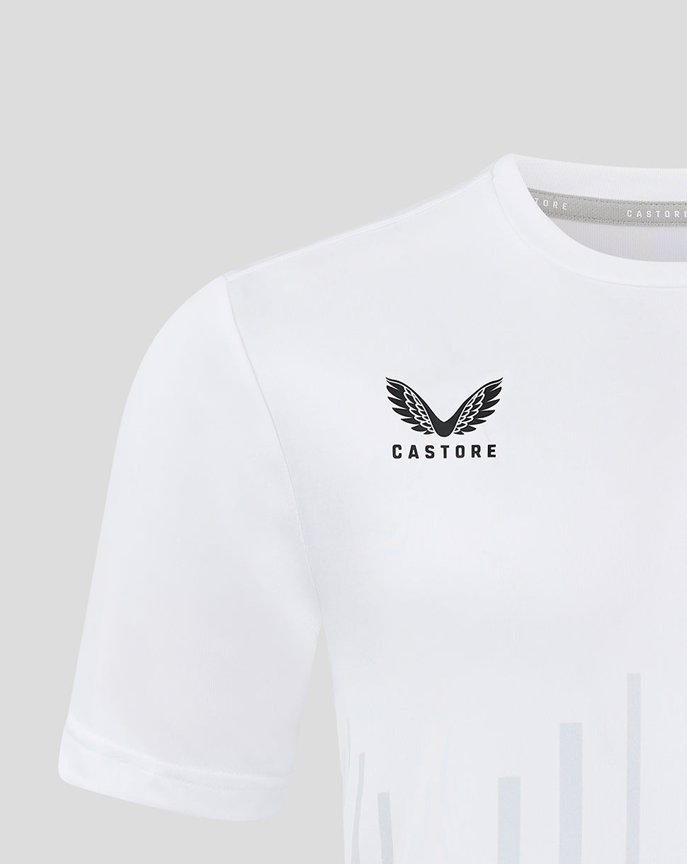 Close up of white junior training T shirt showing pale vertical stripes and Castore logo on chest