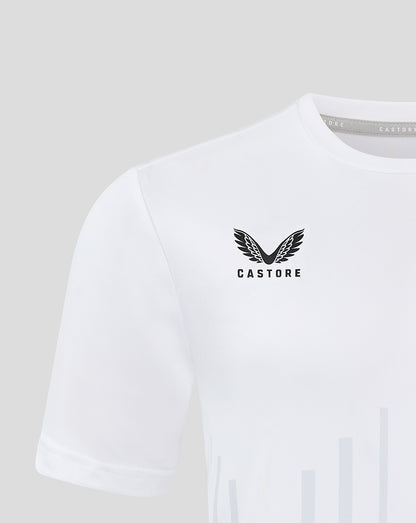 Close up of white junior training T shirt showing pale vertical stripes and Castore logo on chest