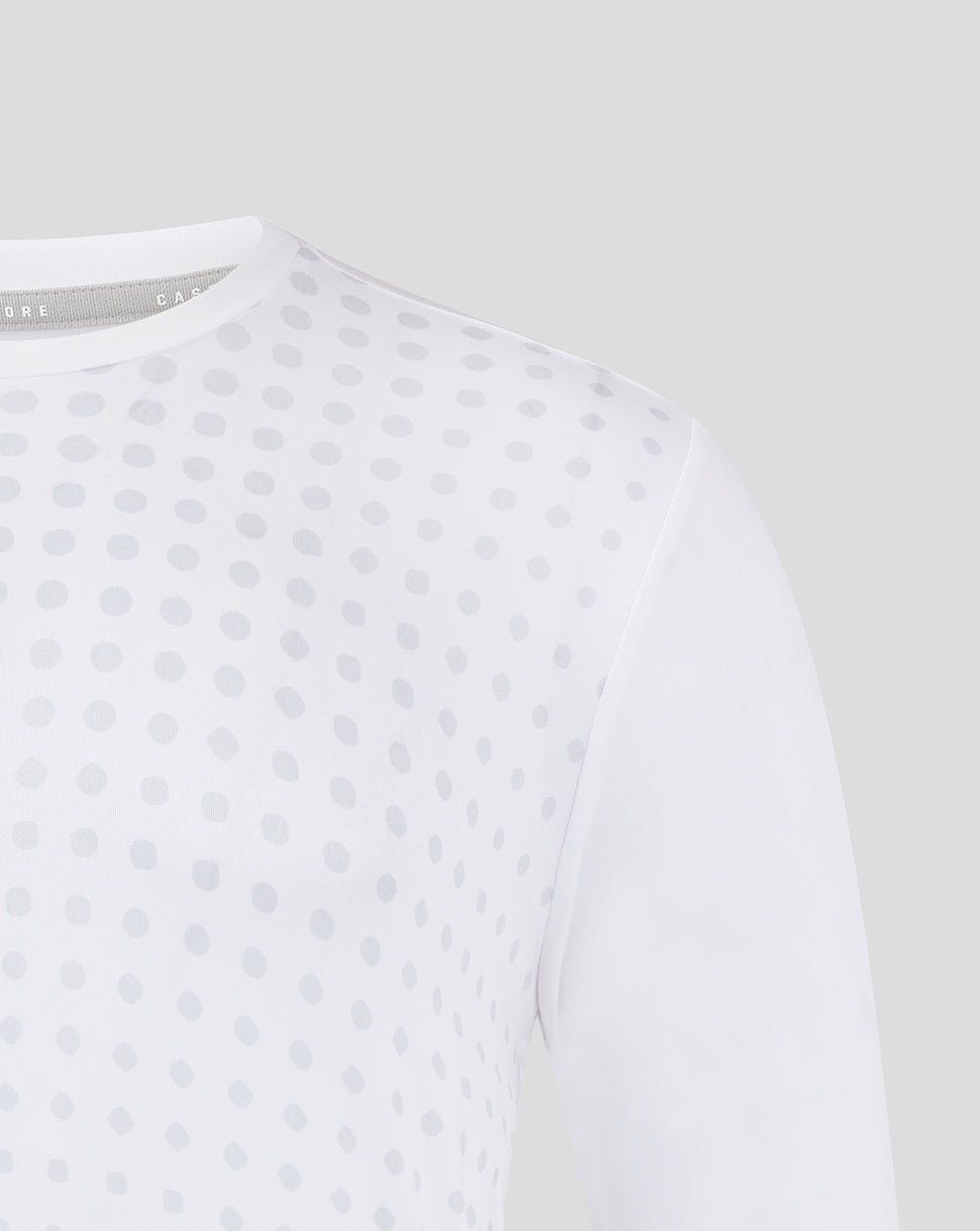 White training tee with an allover light gray dot pattern shown up close.