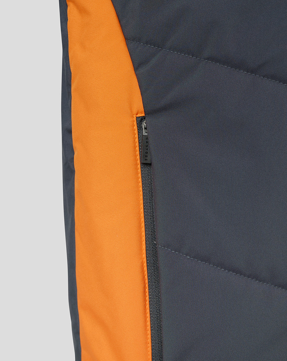Side view of navy Rangers bench gilet showing bright orange side panel and zip pocket detail.