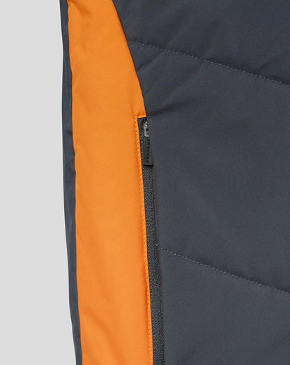 Side view of navy Rangers bench gilet showing bright orange side panel and zip pocket detail.