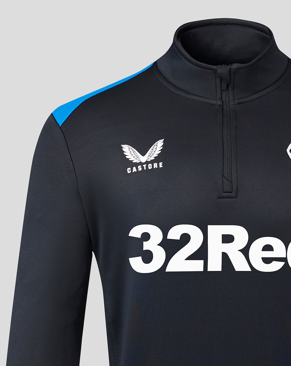 Close-up of black navy Matchday fleece with blue shoulder panels and funnel collar, left chest club crest and Castore logo