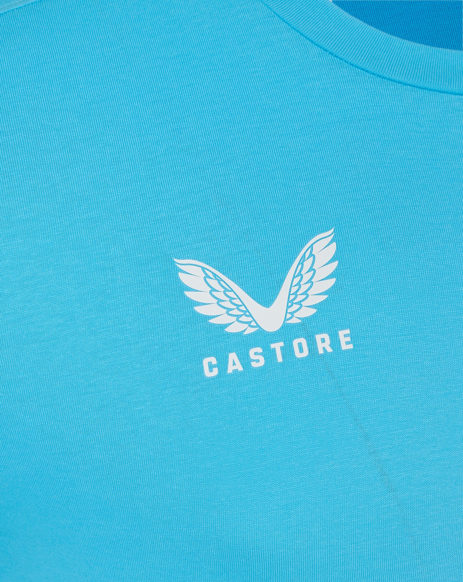 Back view of turquoise Castore Aquarius tee with smooth fabric and curved neckline