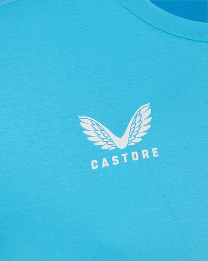 Back view of turquoise Castore Aquarius tee with smooth fabric and curved neckline
