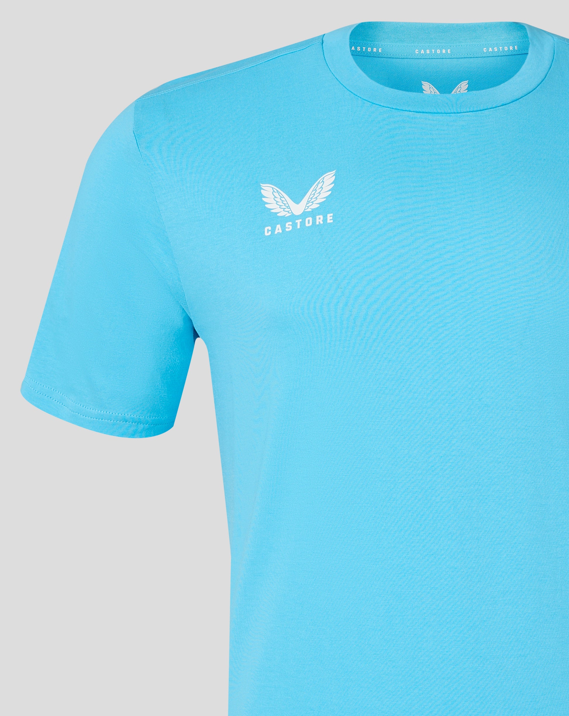 Light blue men's cotton leisure tee with white winged Castore logo on chest
